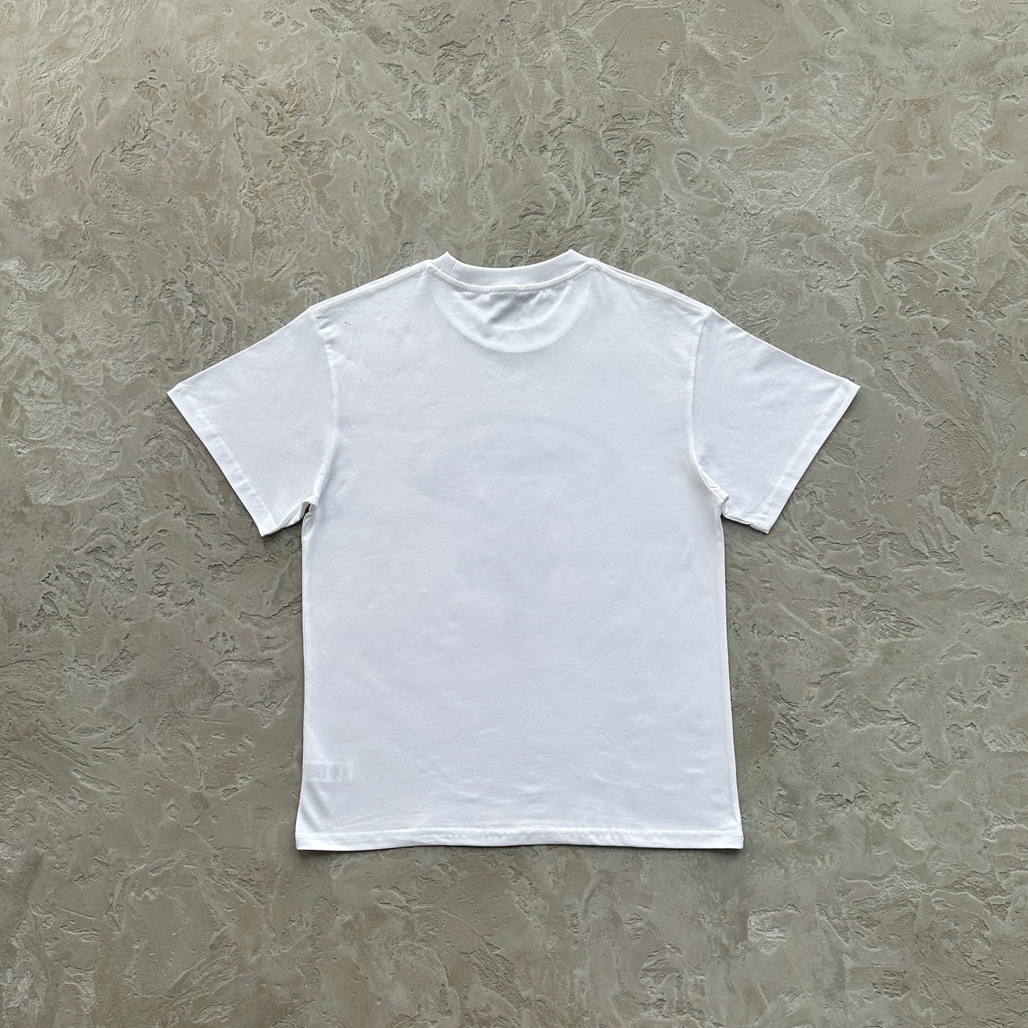 flying man statue tee