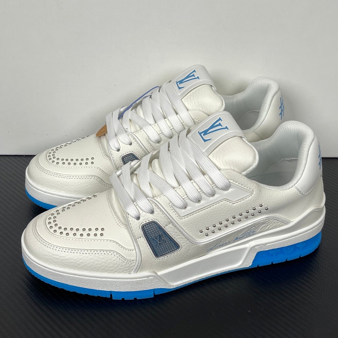 Trainer White and Blue Sole